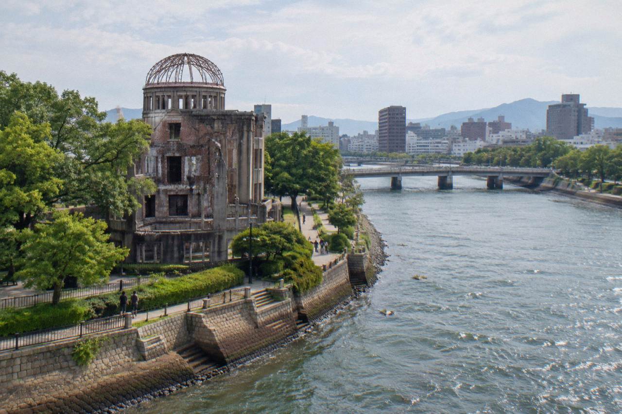 The A-Bomb Dome in Hiroshima standing beside the Motoyasu River in the late afternoon