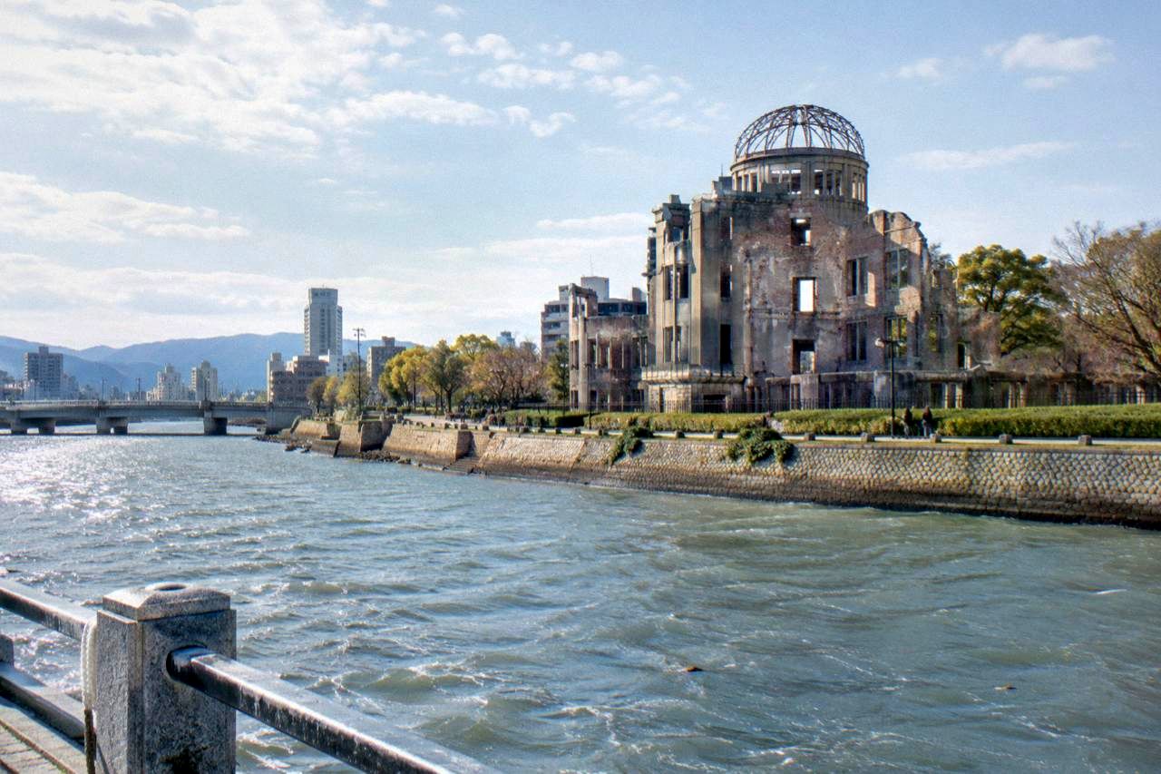 The open lawns and memorials of the Hiroshima Peace Memorial Park along the river