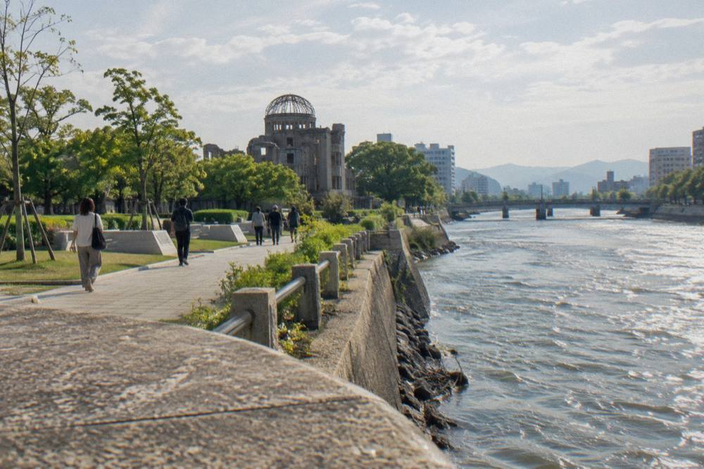 Visitors walking along the paths of the Peace Memorial Park in Hiroshima