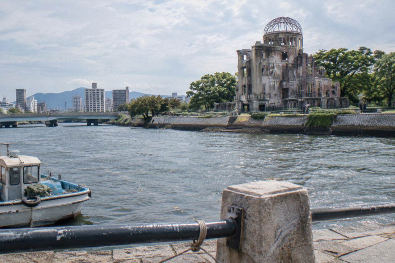 The A-Bomb Dome in Hiroshima Peace Memorial Park seen across the river in the late afternoon