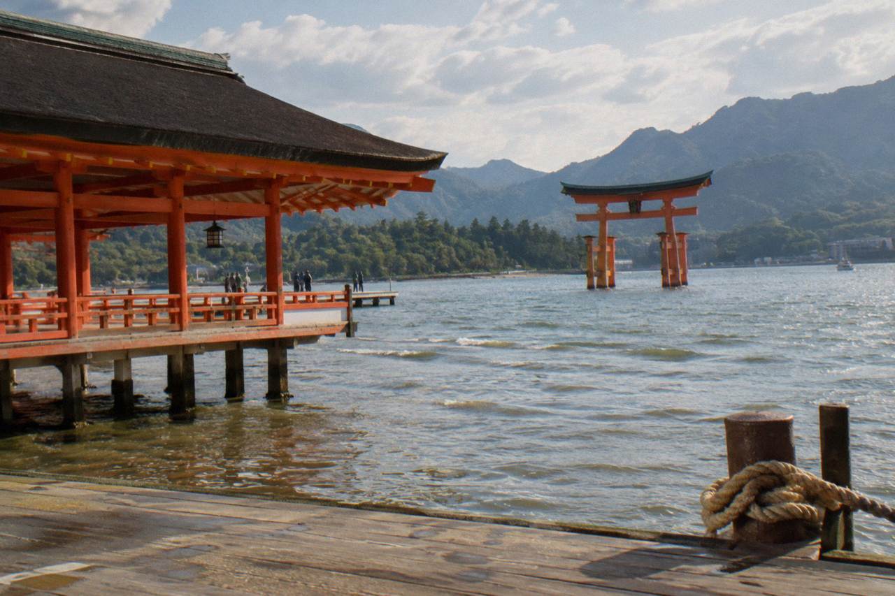 The red gate of Itsukushima Shrine standing in the shallows of Hiroshima Bay at Miyajima