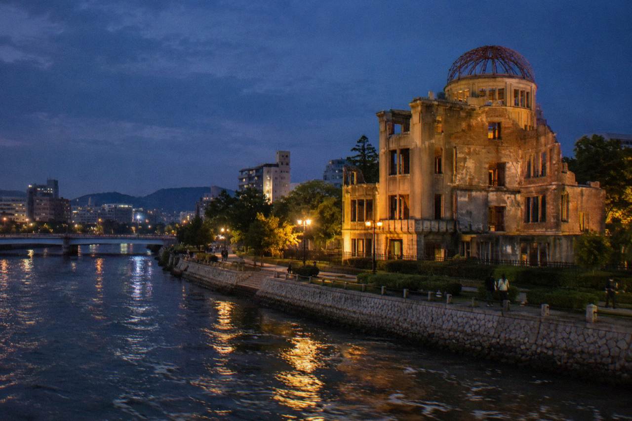 The Peace Memorial Park in Hiroshima with the A-Bomb Dome beside the river at dusk