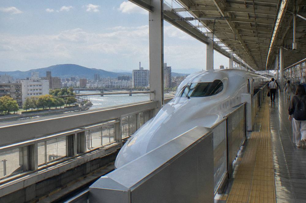 A Shinkansen bullet train platform at Hiroshima Station seen from the concourse