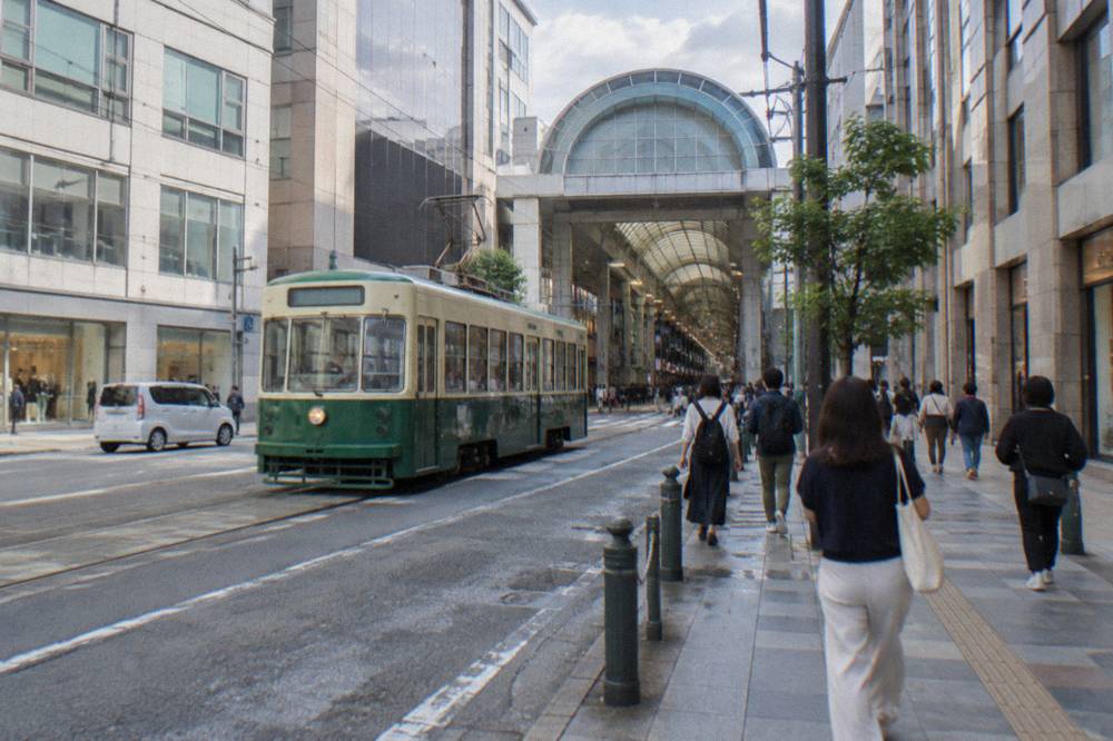 Hacchobori downtown shopping street in Hiroshima with department stores and the Hondori covered arcade entrance