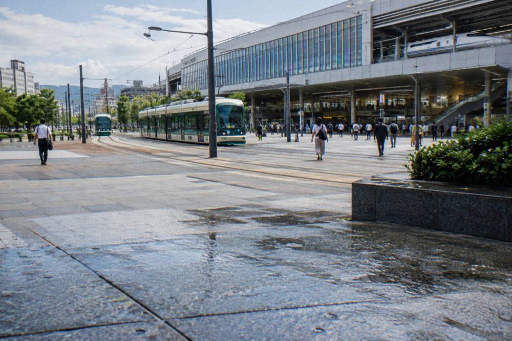Hiroshima Station building with tram tracks and the Shinkansen entrance