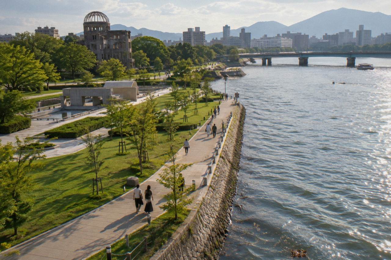 The Peace Memorial Park in Hiroshima stretching along the river with green lawns and trees