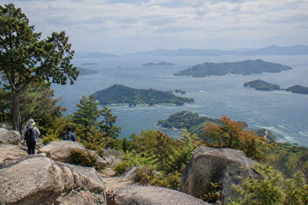 Panoramic view over scattered islands in a calm inland sea from a mountain lookout