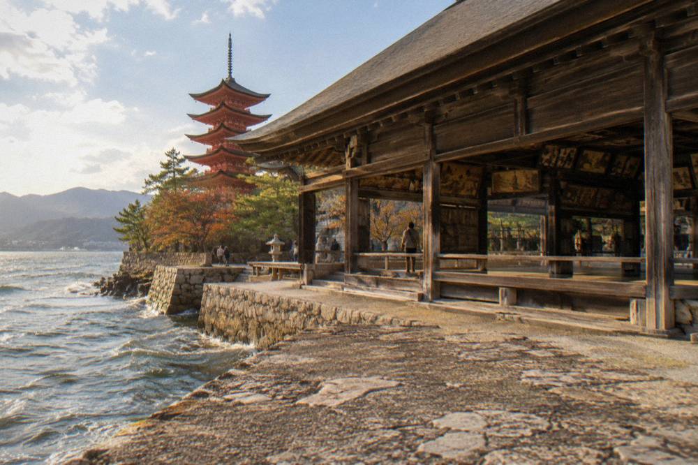 Votive paintings and wooden beams inside the open hall at Senjokaku