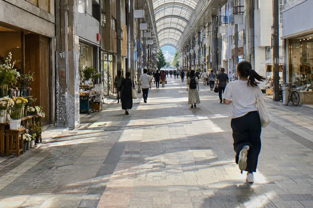 A long view down a roofed arcade showing a straight line
