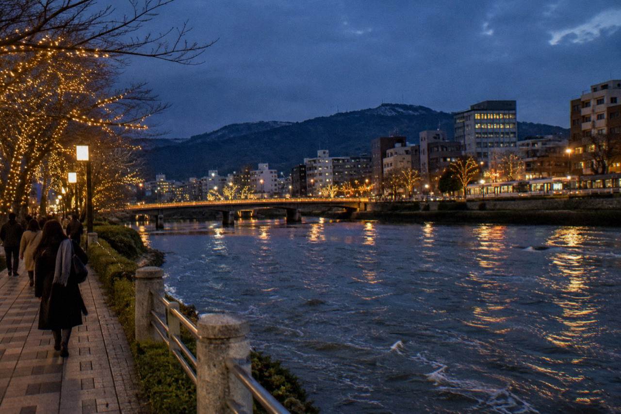 Illuminated winter lights along a city boulevard in Hiroshima at dusk