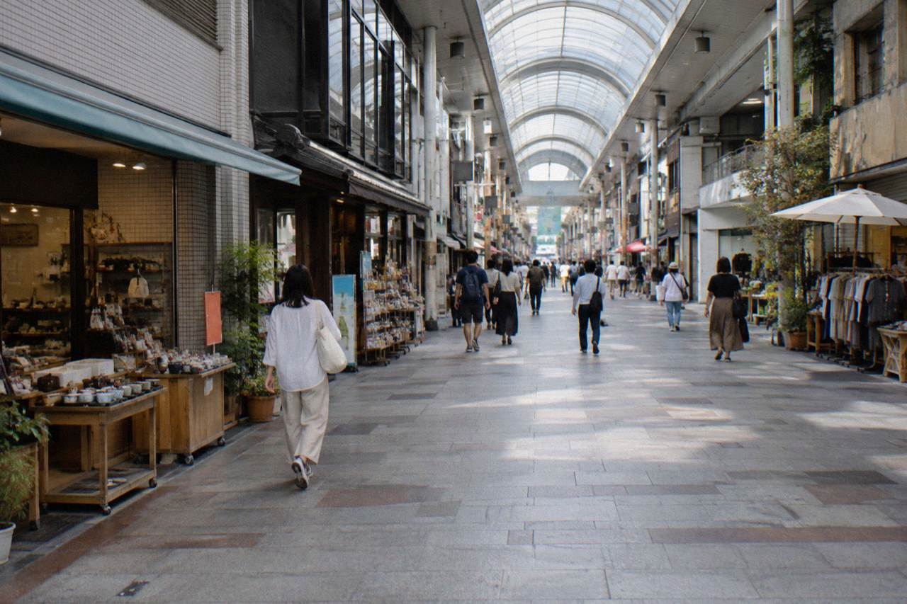 A covered shopping arcade in Hiroshima with small shops on both sides