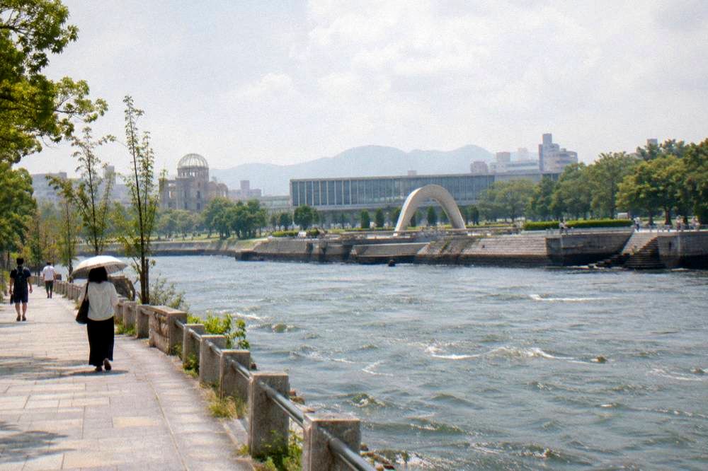 Peace Memorial Park in Hiroshima with the cenotaph frame and museum building beyond