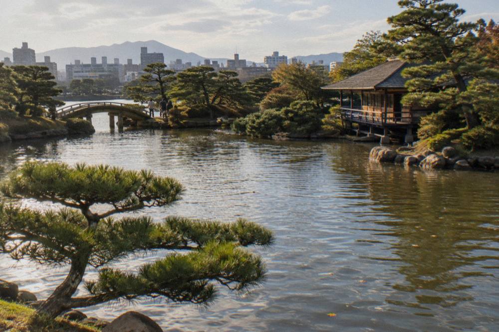 Pond and pine trees inside Shukkeien garden in Hiroshima
