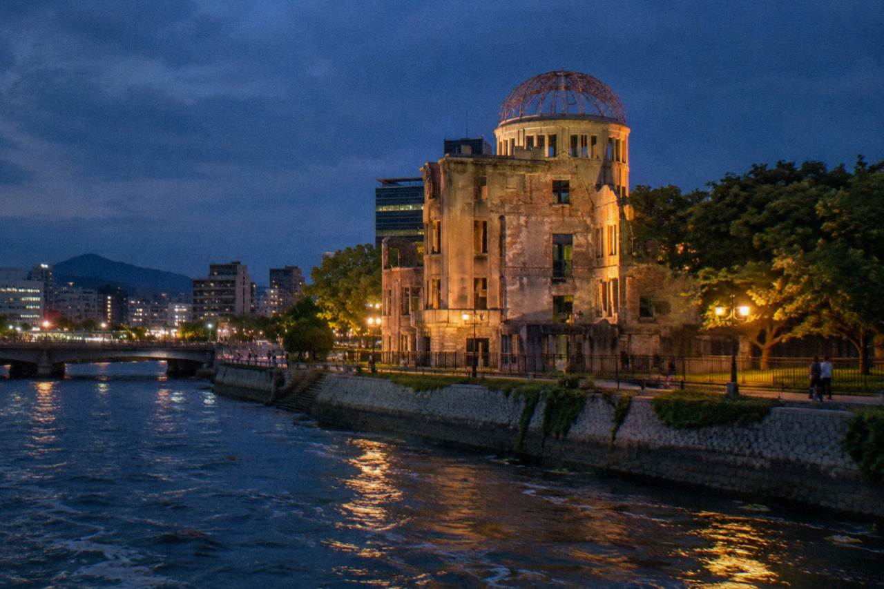 The A-Bomb Dome in Hiroshima standing beside the Motoyasu River at dusk