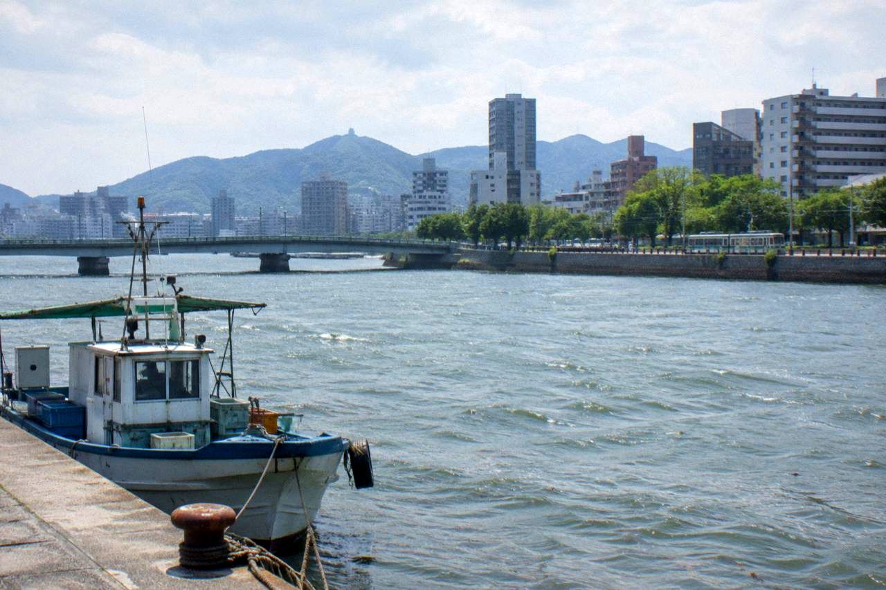 Hiroshima city skyline with the Ota River and Seto Inland Sea hills in the background