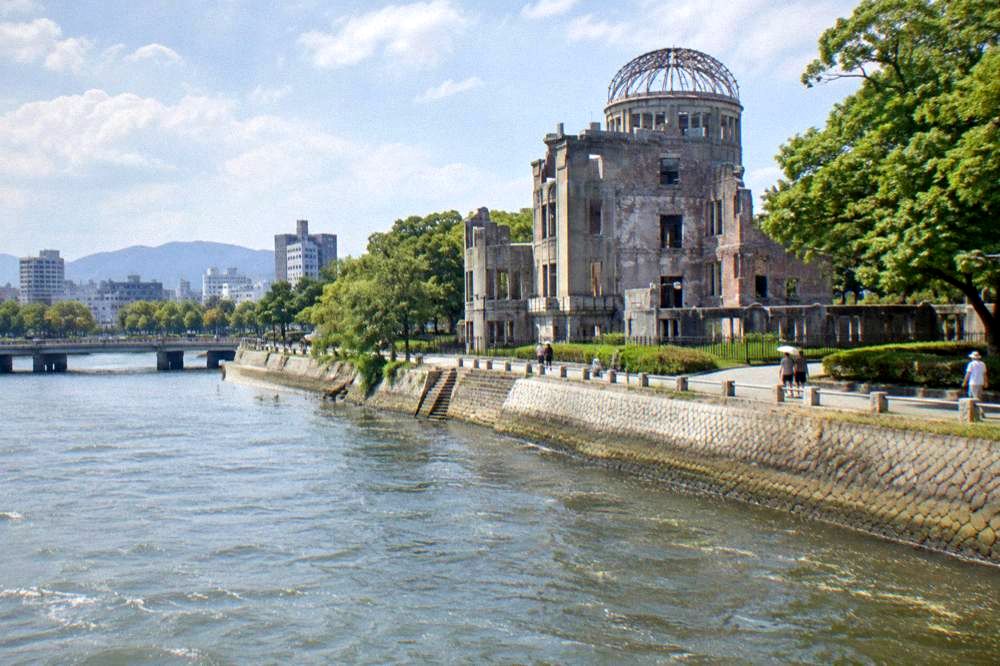 Bright summer sunshine over the Motoyasu river and the A-Bomb Dome in Hiroshima
