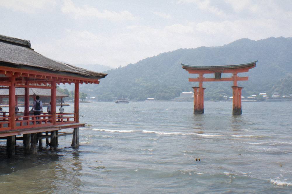 The Great Torii of Itsukushima Shrine standing in the shallows at Miyajima