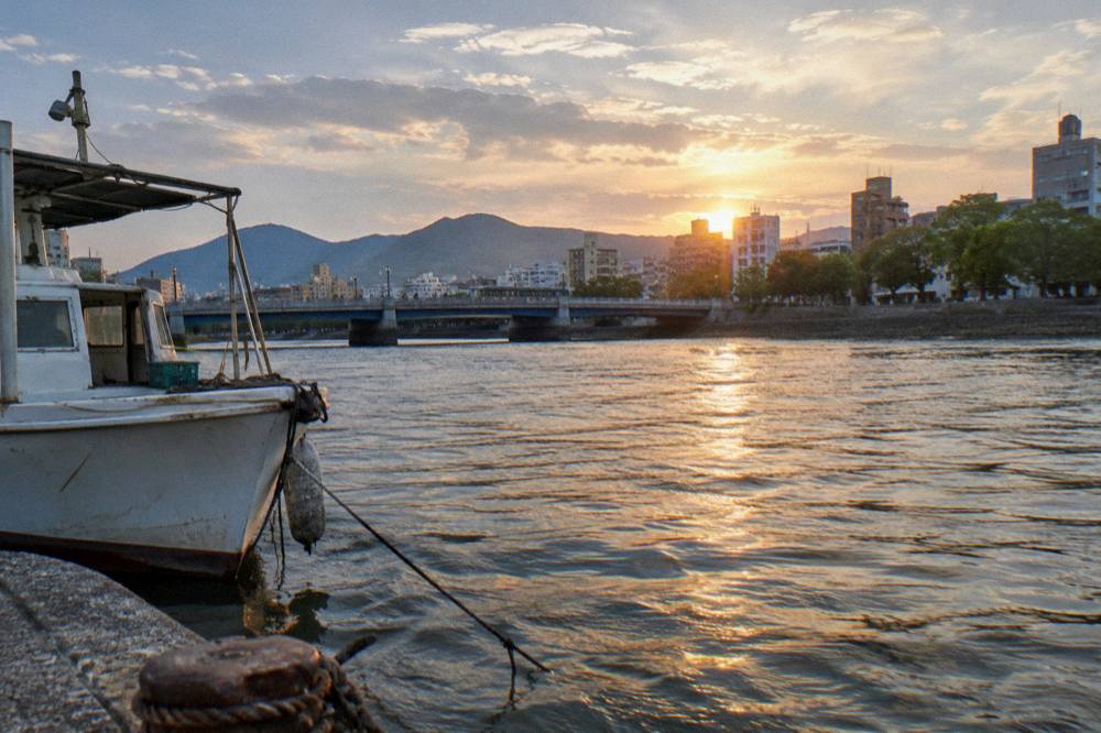 Evening lights reflecting on a river channel in central Hiroshima