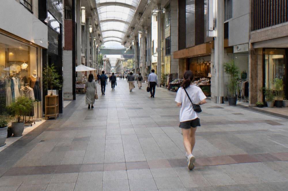 Shoppers walking along the covered Hondori pedestrian arcade in downtown Hiroshima