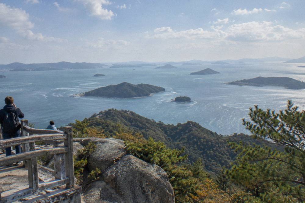 View from a Mount Misen lookout over forested ridges and islands in the Seto Inland Sea.