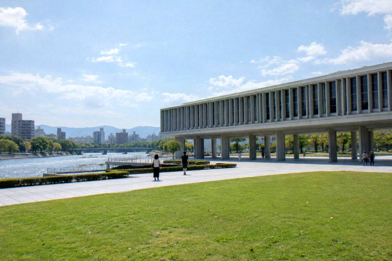 The Hiroshima Peace Memorial Museum building beside the quiet park grounds