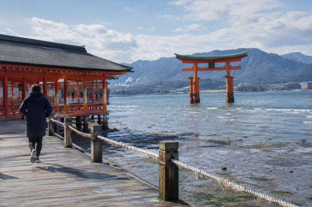 The Great Torii of Itsukushima Shrine standing in the shallows of Hiroshima Bay
