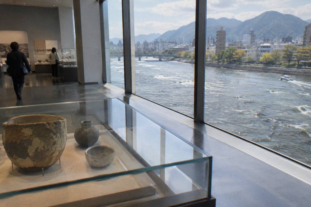 A quiet museum gallery interior with display cases and soft lighting